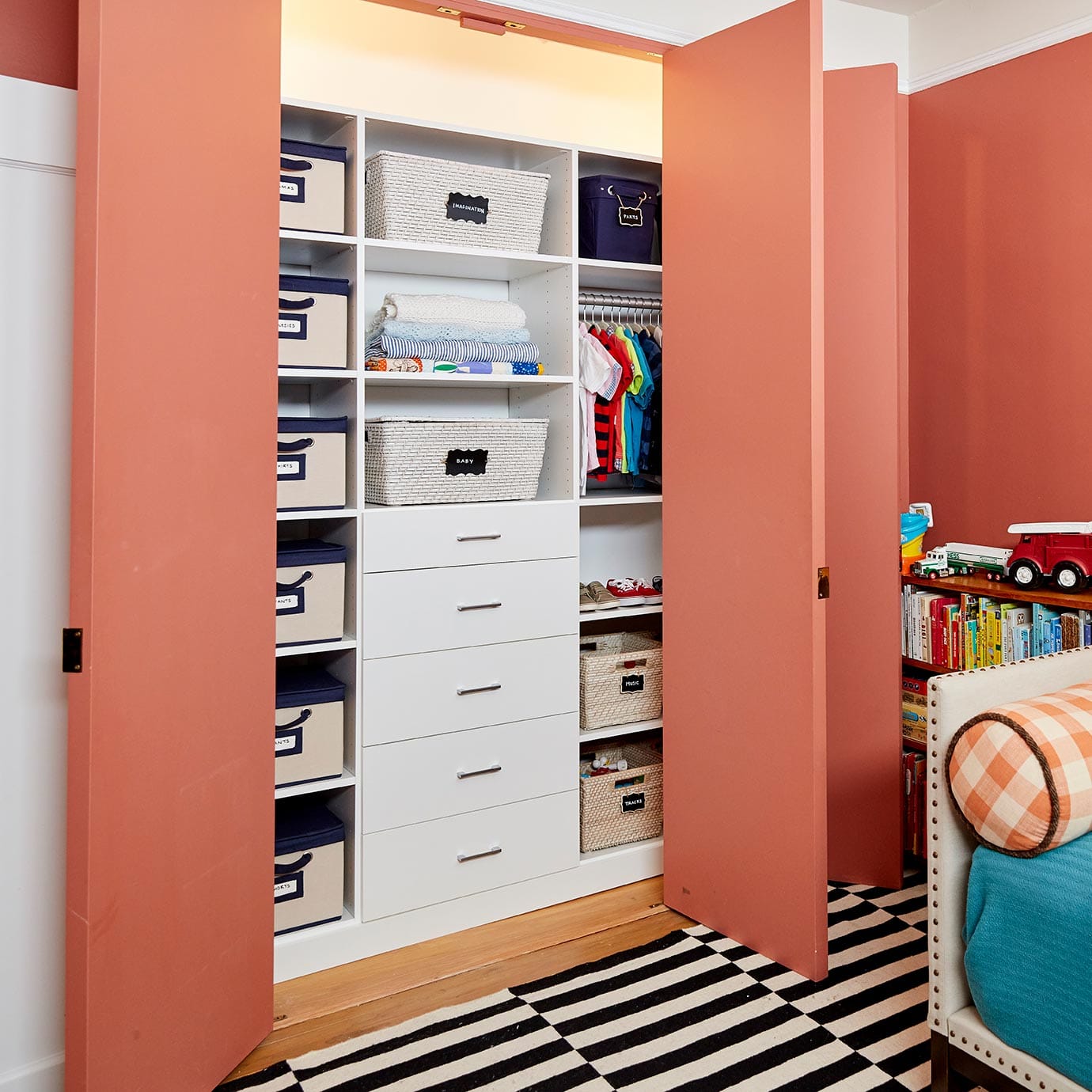 Final reach in closet installation with open shelving and custom drawers, created by California Closets