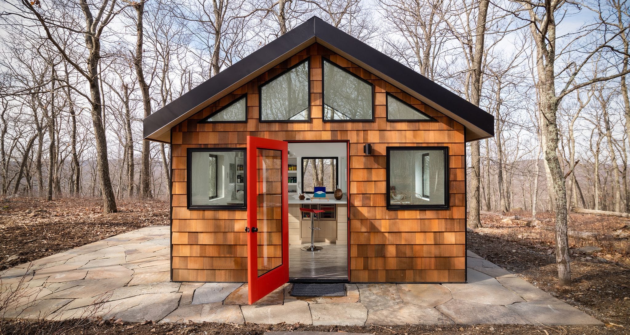 Craft shed for an artist custom built with slot storage, large desk and countertops by California Closets